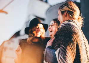 Women laughing and talking about mental health
